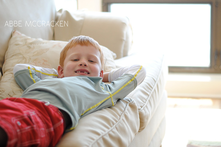 boy relaxing at beach condo in the Ocean Club at Wild Dunes