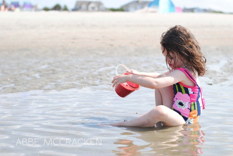young girl playing in the tide pools on Isle of Palms