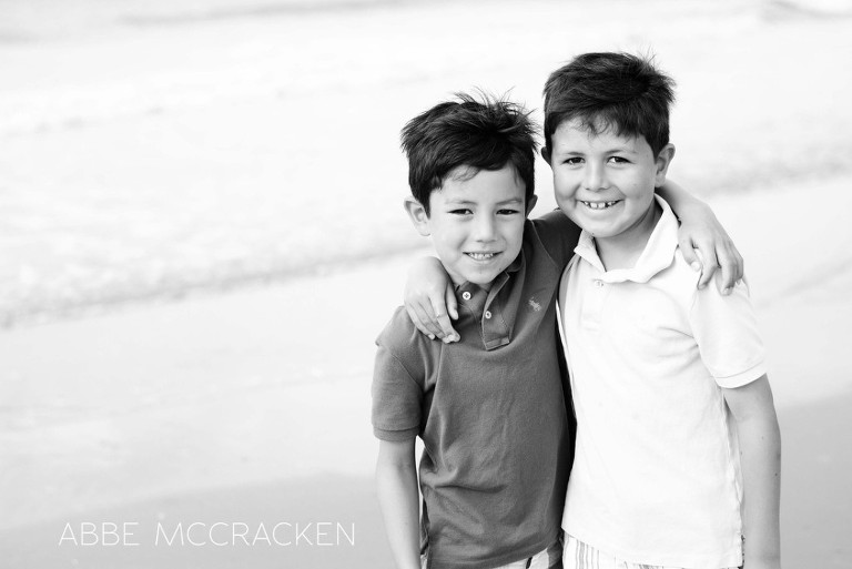 brothers with arms around each other on the beach, Wild Dunes