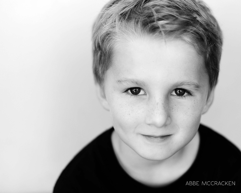 photographer's kid - freckled child connecting with his photographer mom