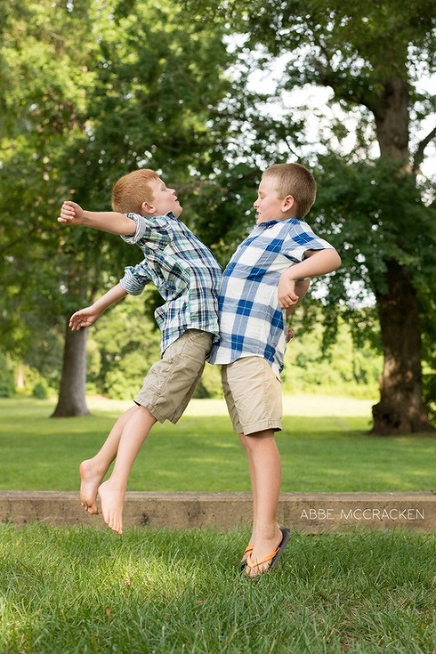 two boy cousins chest bumping