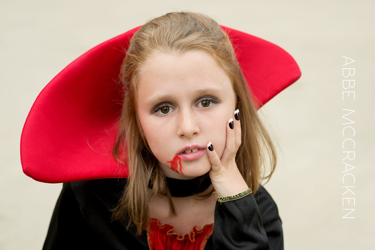 young girl dressed in vampire costume for Halloween