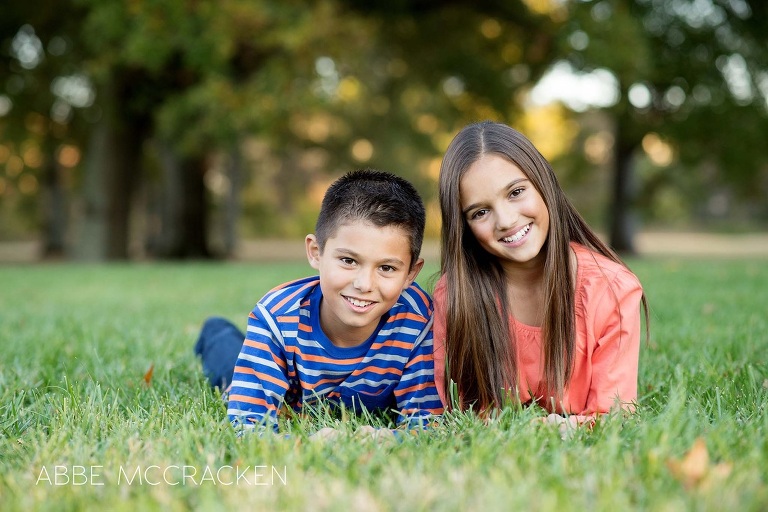 children laying in the grass at The Mint Museum