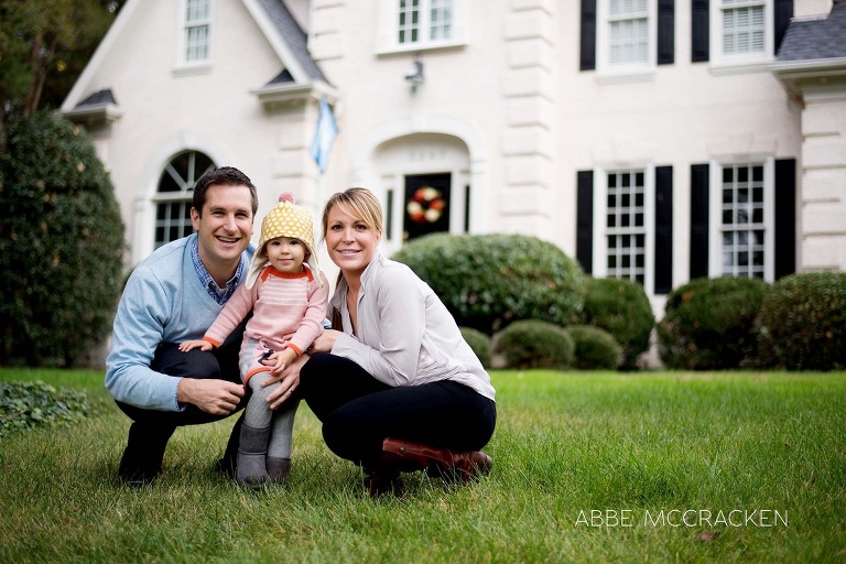 family portrait in front of their home
