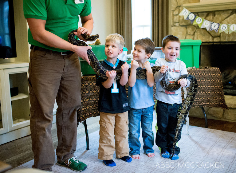 children at the birthday party holding the snake
