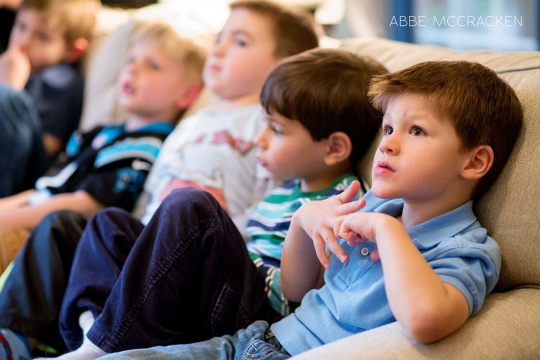 birthday boy and friends watch the reptile presentation with amazement