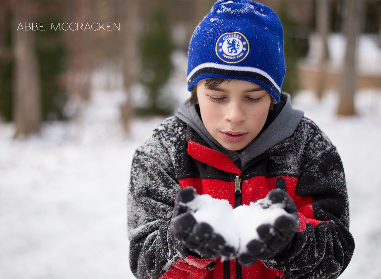 teen boy preparing to blow snow