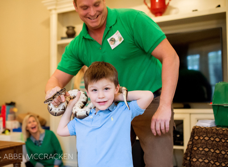 birthday boy learning how to handle a snake