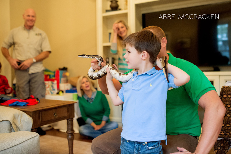 birthday boy learning how to handle a snake