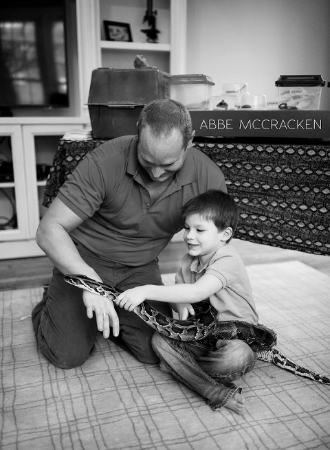 birthday boy playing with a massive snake