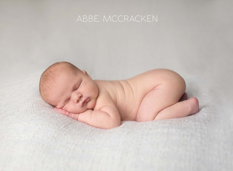 newborn portraits - baby boy lying on tummy