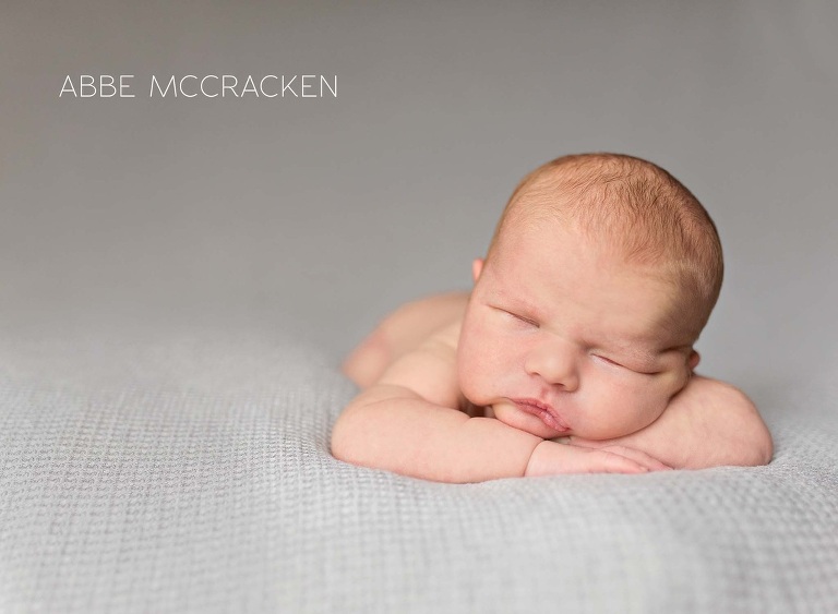 newborn portraiture - baby boy head on hands pose