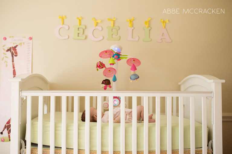 nursery room with 4 month old baby girl in her crib