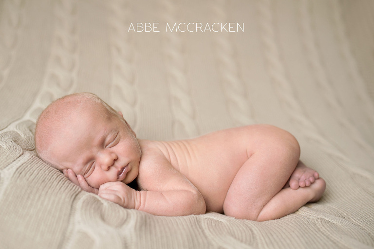 newborn portraits - sweet baby boy on tan blanket