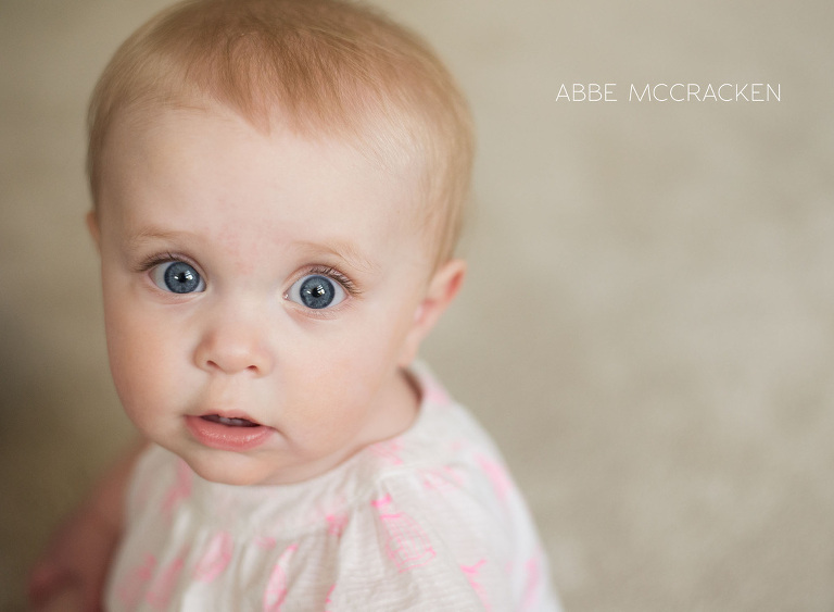 blue-eyed 8 month old baby girl