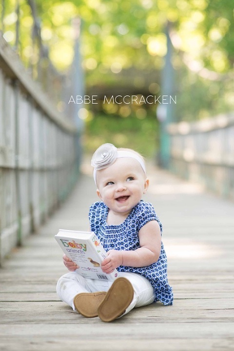 adorable one year old and her favorite book