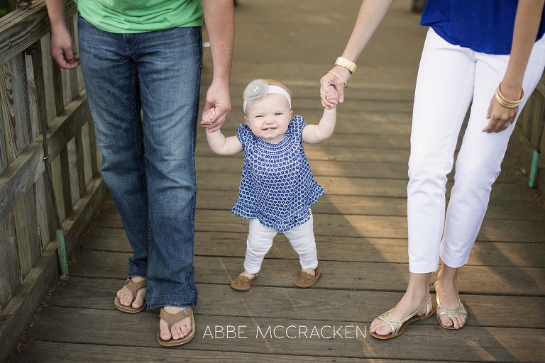 baby learning to walk is proud of herself