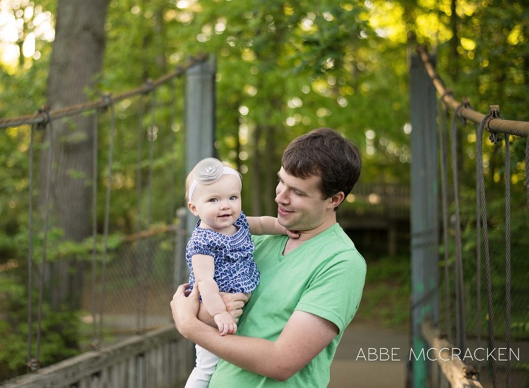 father holding his one year old daughter