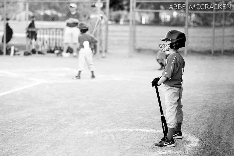 child waiting for his turn at bat - youth baseball at South Charlotte Recreation Association