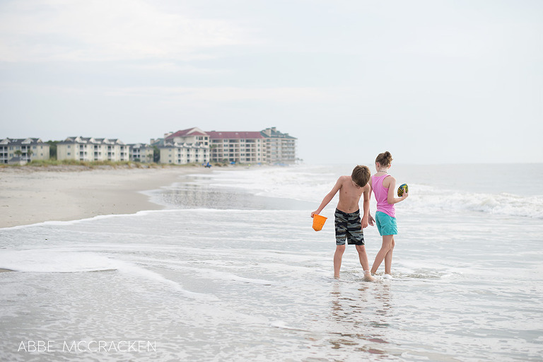 Young cousins playing at beach