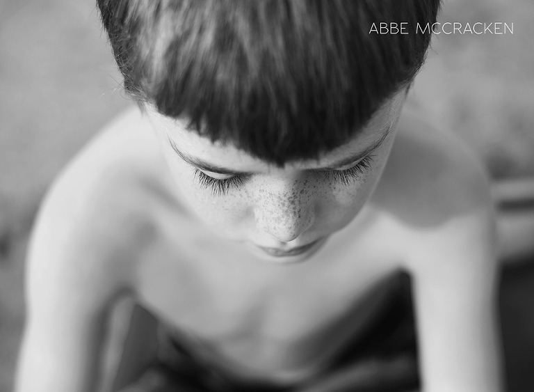 young boy with stunning freckles and lashes