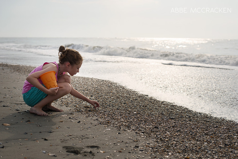 Child hunting for beach treasures