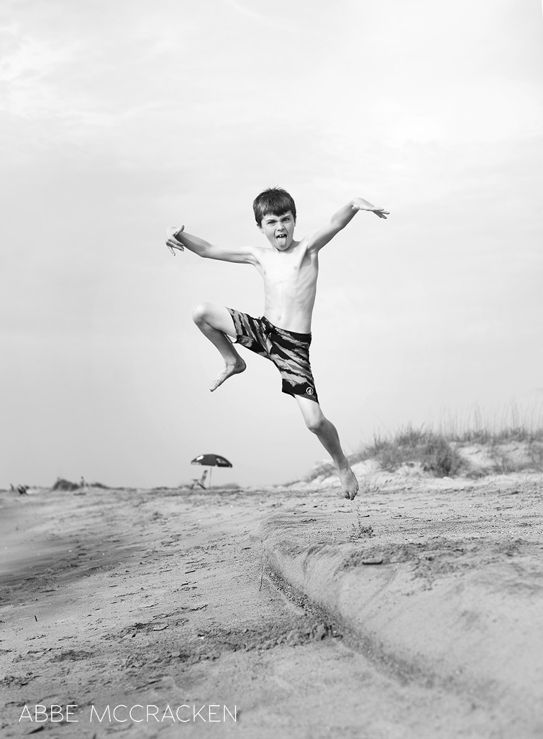 Child catching some air at the beach