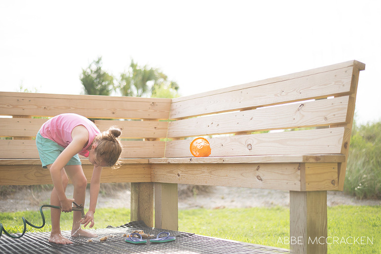 Tween girl washing sea shells