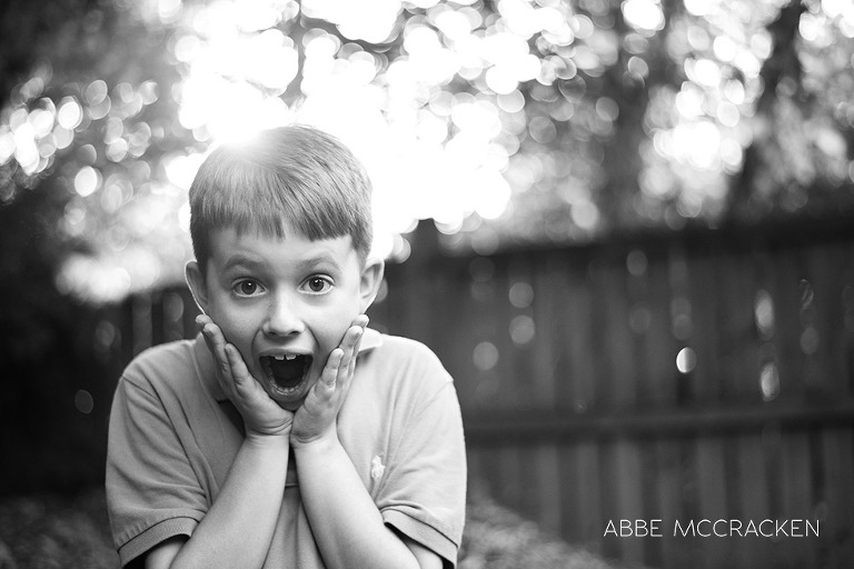 candid of boy with summer backlighting