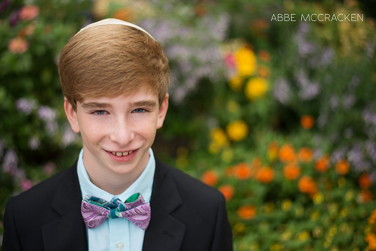 Bar Mitzvah portrait with colorful garden in background