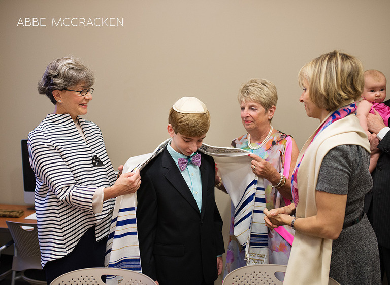 Jewish boy in room with Rabbi and his grandmothers