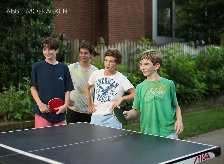 Friends playing ping pong at Bar Mitzvah after party