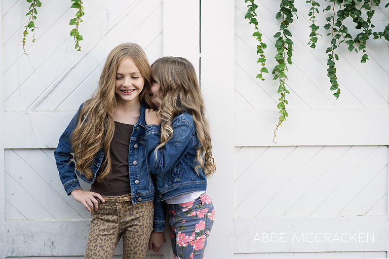adorable kids in jean jackets against a white wall