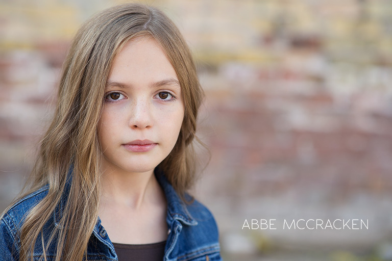 headshot of gorgeous young model in urban setting
