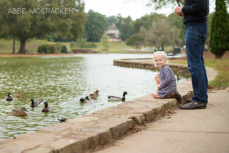 young girl feeding ducks at Freedom Park in Charlotte