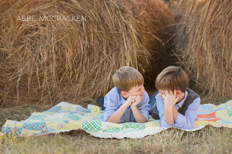 children telling stories amongst hay bales