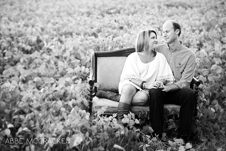 parents admiring each other, sitting in a soybean field north of Charlotte, NC
