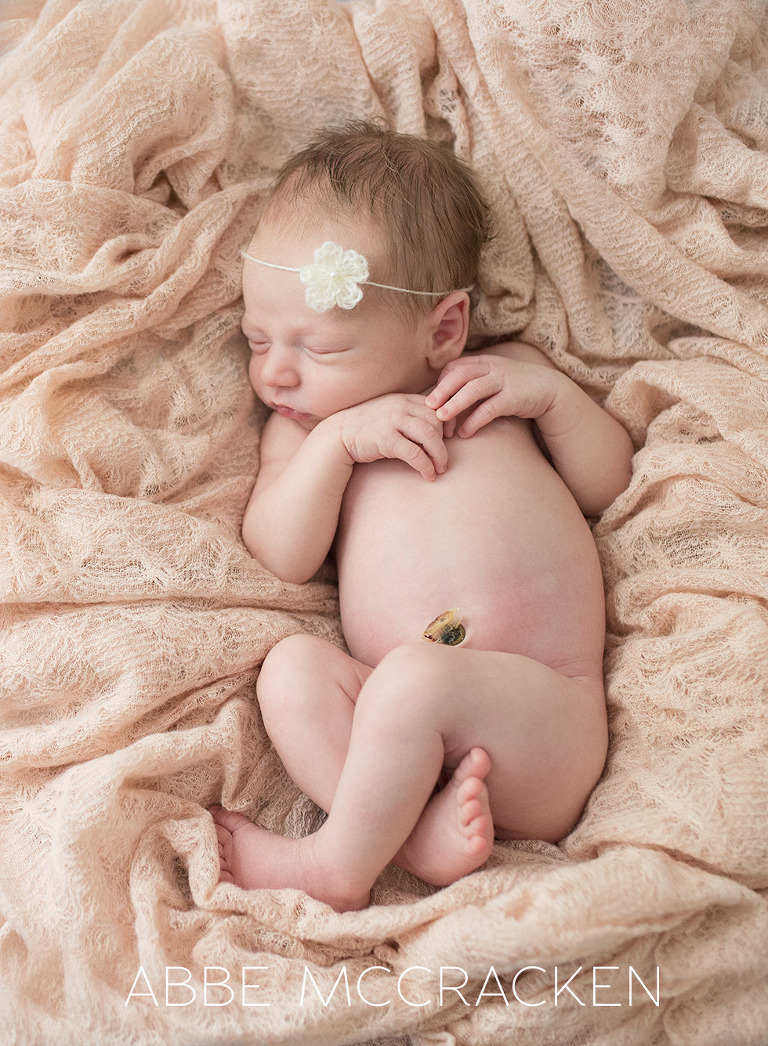 newborn baby girl with cream floral tie back