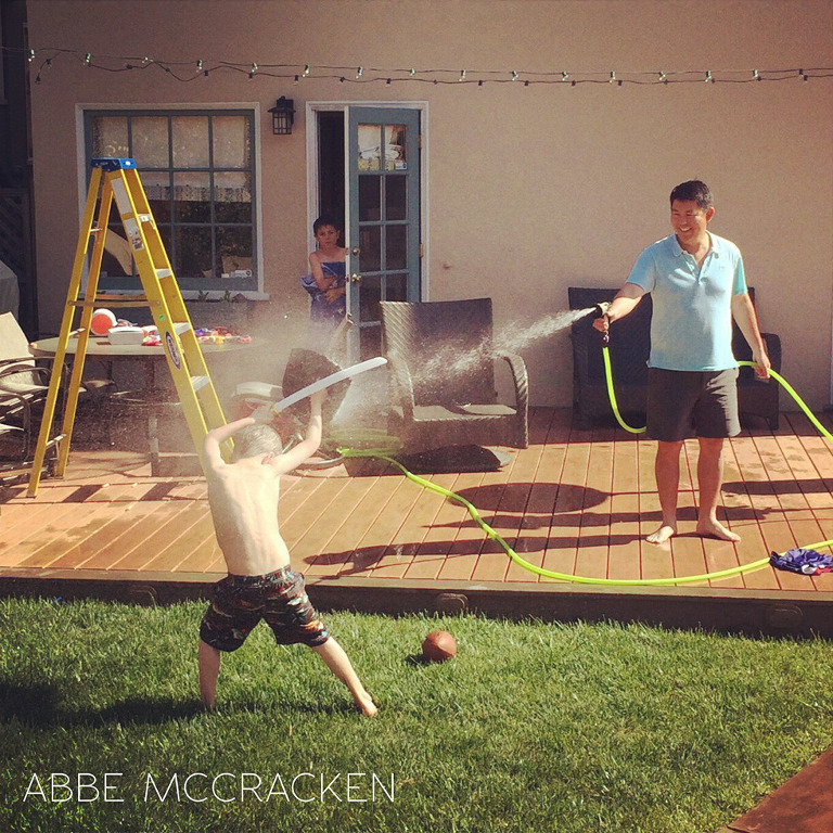 boy being blasted with water from personal Instagram 365, iphoneography