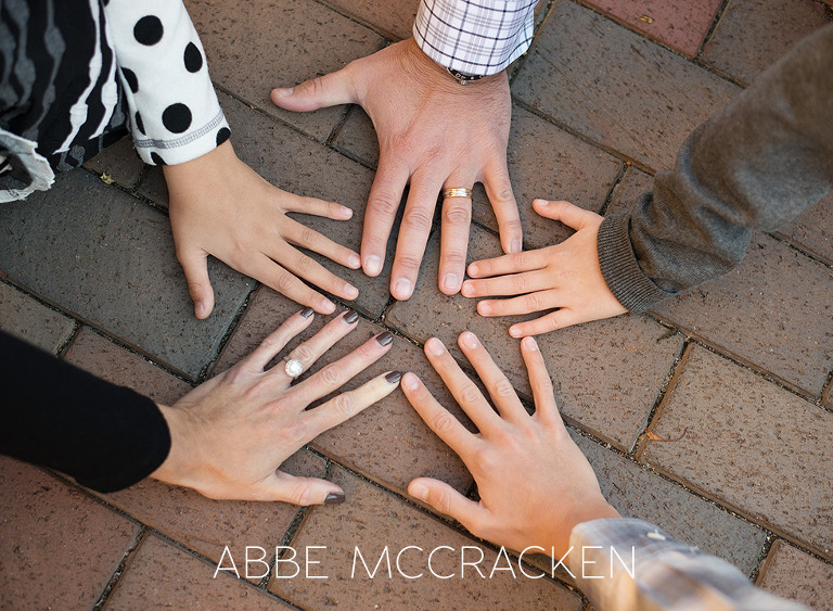family portraits of hands - each member putting one hand in the circle