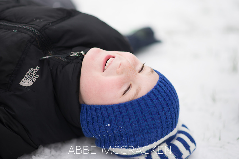 Child enjoying the Charlotte NC snow by Charlotte Children's Photographer Abbe McCracken