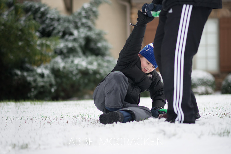 Father and son enjoying the recent Charlotte NC snow | Abbe McCracken Photography
