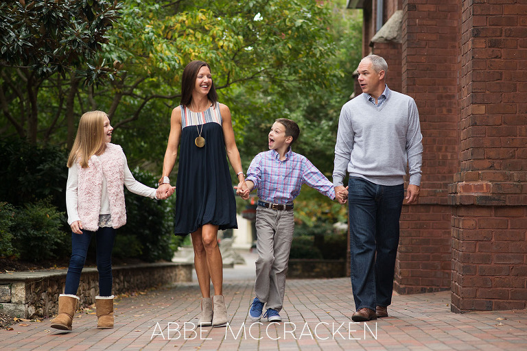 Candid photography of a family walking in Uptown Charlotte, NC
