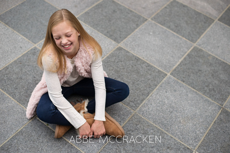 Young blonde girl laughing