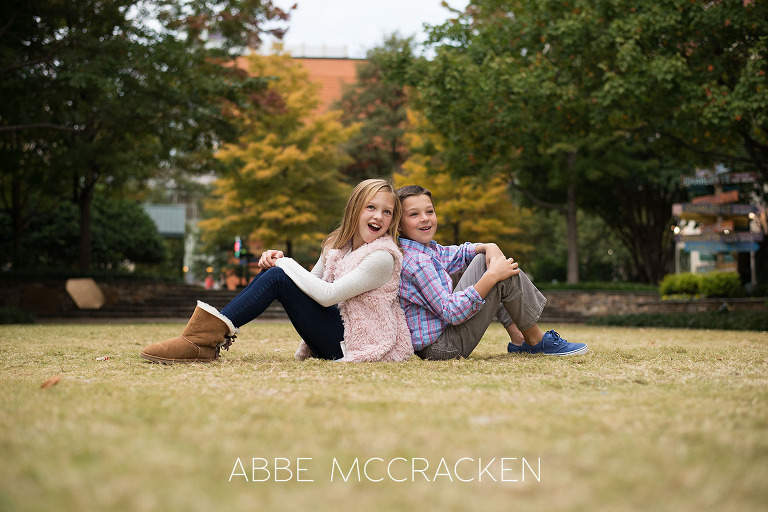 Candid sibling portrait photographed on The Green in Uptown Charlotte