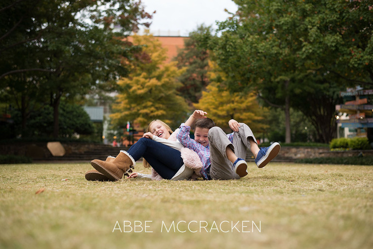 Candid sibling portrait photographed on The Green in Uptown Charlotte