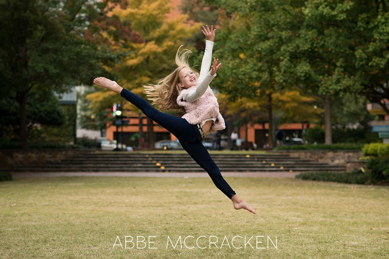 young girl practicing gymnastics on The Green in Uptown Charlotte