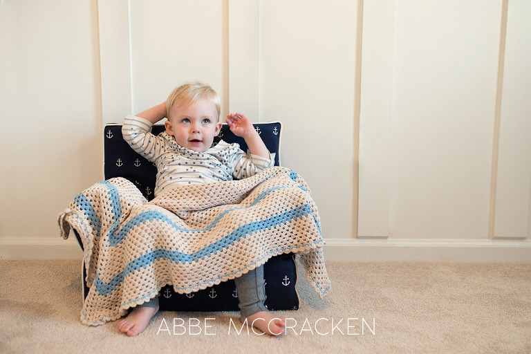 Toddler sister during baby brother's at home newborn session