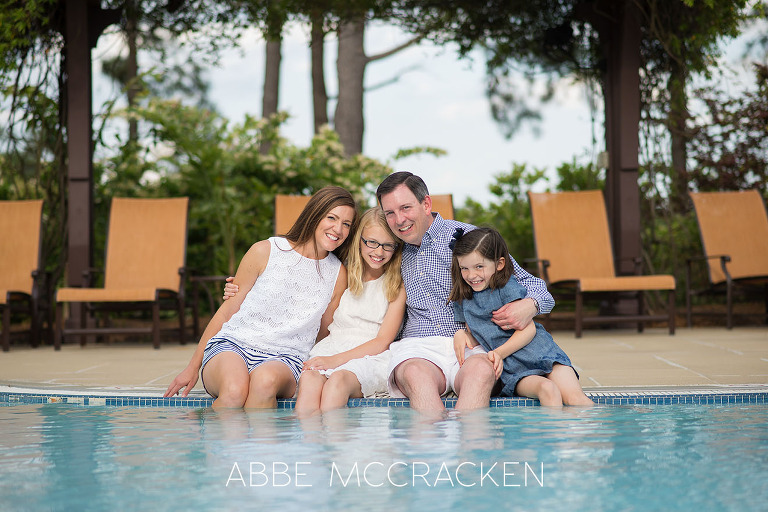 Casual family portrait on the side of the pool at Carmel Country Club
