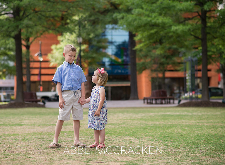 Photo of siblings taken during spring family portraits in Uptown Charlotte
